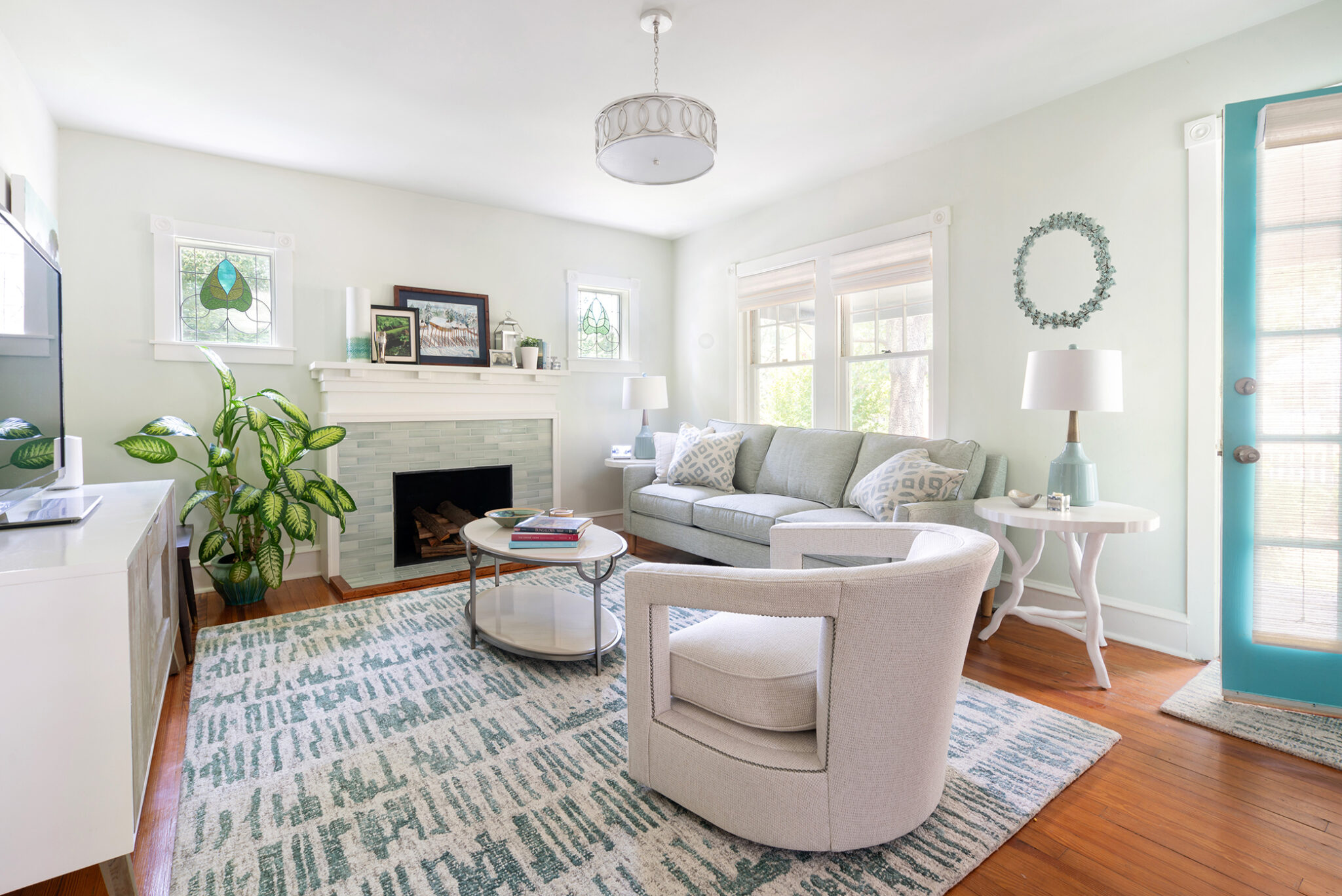 best interior design services for living rooms in Santa Rosa Beach FL, custom white furniture set against bright living room with hardwood flooring
